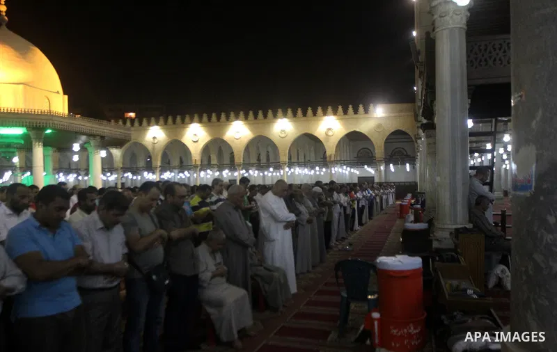 Egyptian worshipers perform take part in an evening prayer "Taraweeh", at Amr Ibn al-Aas mosque, in Cairo on June 17, 2015. Millions of Muslims around the world will mark the start of Ramadan on Thursday June 18, a month...