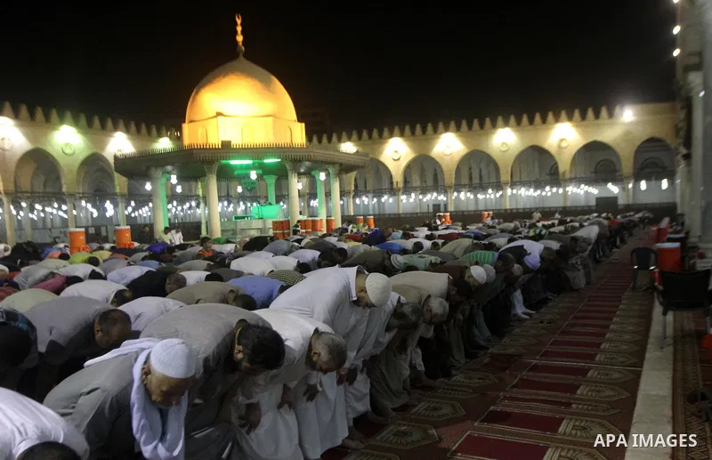Egyptian worshipers perform take part in an evening prayer "Taraweeh", at Amr Ibn al-Aas mosque, in Cairo on June 17, 2015. Millions of Muslims around the world will mark the start of Ramadan on Thursday June 18, a month...