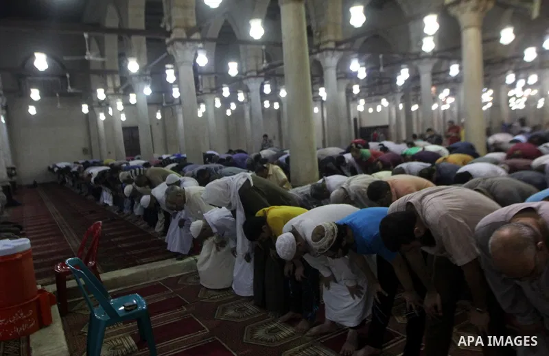 Egyptian worshipers perform take part in an evening prayer "Taraweeh", at Amr Ibn al-Aas mosque, in Cairo on June 17, 2015. Millions of Muslims around the world will mark the start of Ramadan on Thursday June 18, a month...