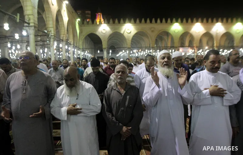 Egyptian worshipers perform take part in an evening prayer "Taraweeh", at Amr Ibn al-Aas mosque, in Cairo on June 17, 2015. Millions of Muslims around the world will mark the start of Ramadan on Thursday June 18, a month...
