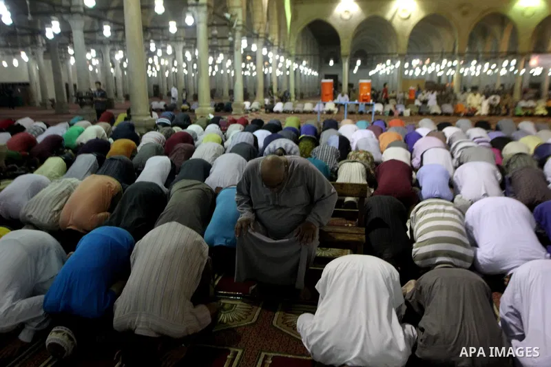 Egyptian worshipers perform take part in an evening prayer "Taraweeh", at Amr Ibn al-Aas mosque, in Cairo on June 17, 2015. Millions of Muslims around the world will mark the start of Ramadan on Thursday June 18, a month...