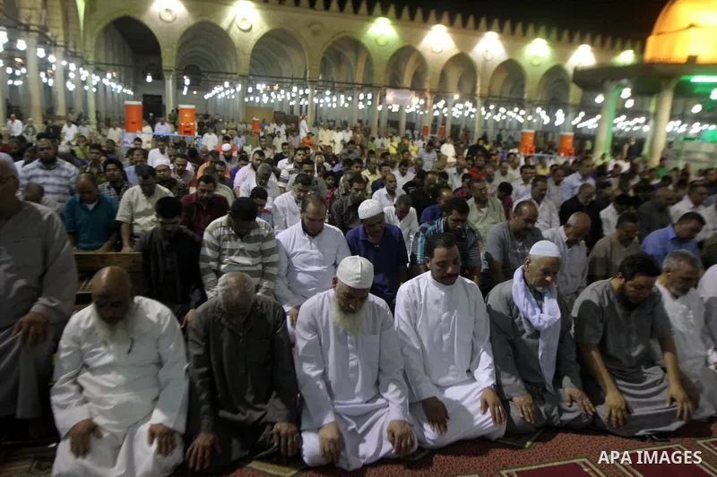 Egyptian worshipers perform take part in an evening prayer "Taraweeh", at Amr Ibn al-Aas mosque, in Cairo on June 17, 2015. Millions of Muslims around the world will mark the start of Ramadan on Thursday June 18, a month...
