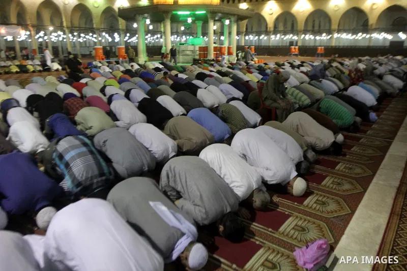 Egyptian worshipers perform take part in an evening prayer "Taraweeh", at Amr Ibn al-Aas mosque, in Cairo on June 17, 2015. Millions of Muslims around the world will mark the start of Ramadan on Thursday June 18, a month...