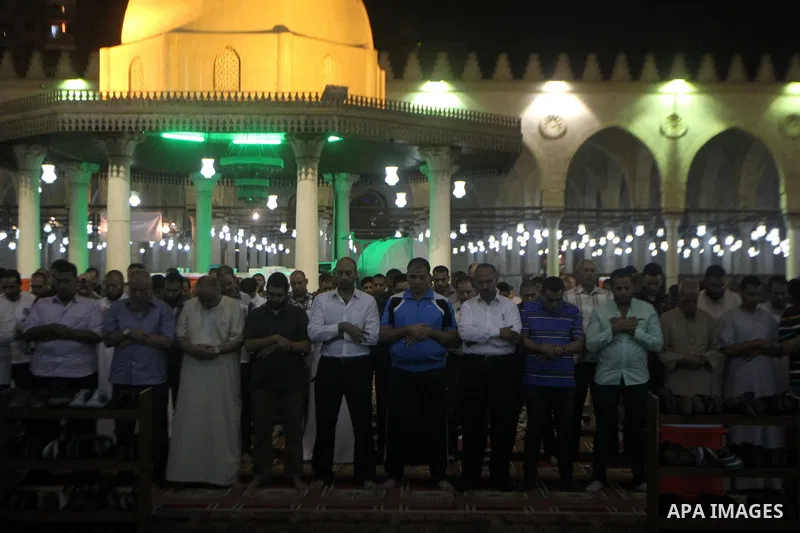 Egyptian worshipers perform take part in an evening prayer "Taraweeh", at Amr Ibn al-Aas mosque, in Cairo on June 17, 2015. Millions of Muslims around the world will mark the start of Ramadan on Thursday June 18, a month...