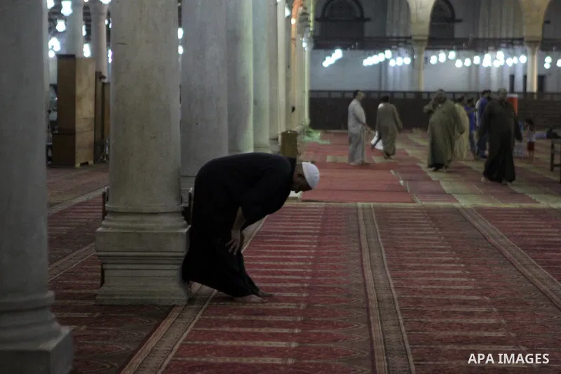 Egyptian worshipers perform take part in an evening prayer "Taraweeh", at Amr Ibn al-Aas mosque, in Cairo on June 17, 2015. Millions of Muslims around the world will mark the start of Ramadan on Thursday June 18, a month...