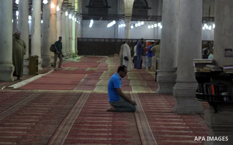 Egyptian worshipers perform take part in an evening prayer "Taraweeh", at Amr Ibn al-Aas mosque, in Cairo on June 17, 2015. Millions of Muslims around the world will mark the start of Ramadan on Thursday June 18, a month...