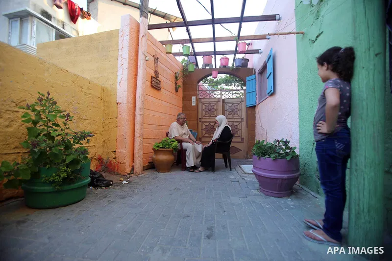 A photo taken on June 17, 2015 shows colored houses in the old city of Gaza, as Palestinians colored the walls of houses in the area to prepare for the start of the Muslim holy fasting month of Ramadan. More than 1.5 bil...