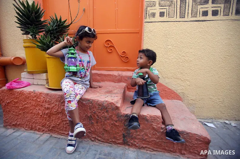 A photo taken on June 17, 2015 shows colored houses in the old city of Gaza, as Palestinians colored the walls of houses in the area to prepare for the start of the Muslim holy fasting month of Ramadan. More than 1.5 bil...