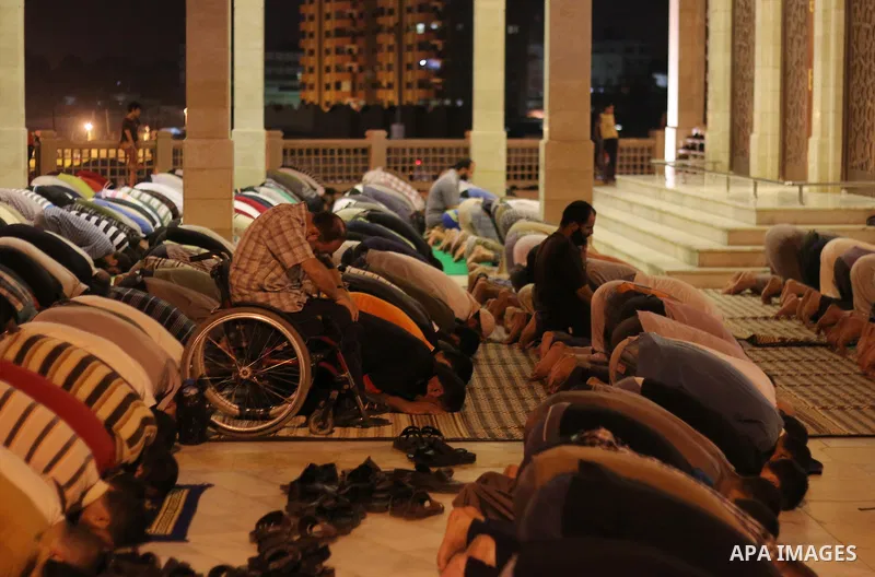 Palestinian worshipers perform take part in an evening prayer "Taraweeh", at El Khalidi mosque, in Gaza city, on June 17, 2015. Millions of Muslims around the world will mark the start of Ramadan on Thursday June 18, a m...