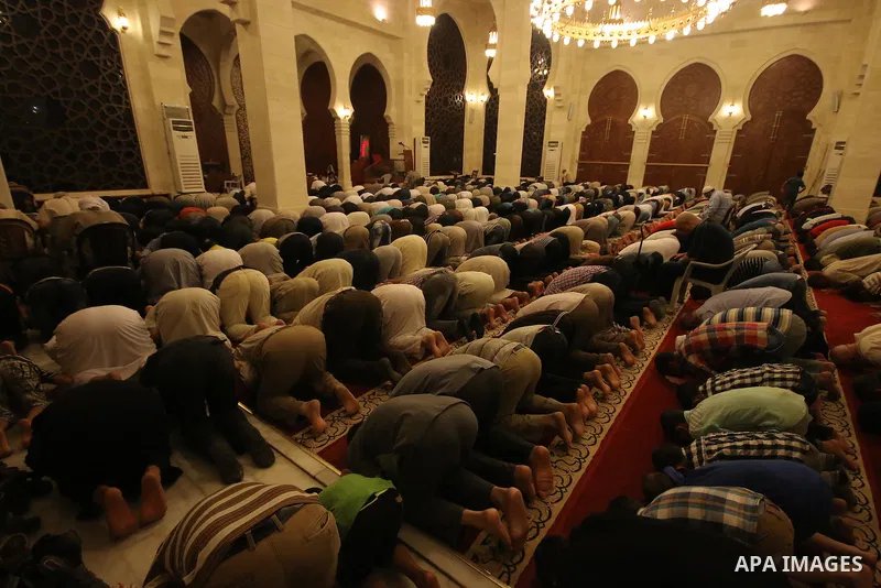 Palestinian worshipers perform take part in an evening prayer "Taraweeh", at El Khalidi mosque, in Gaza city, on June 17, 2015. Millions of Muslims around the world will mark the start of Ramadan on Thursday June 18, a m...