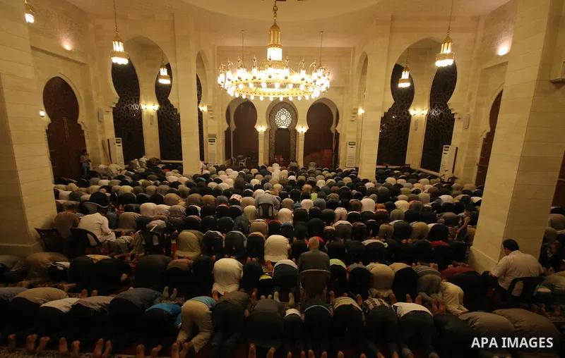 Palestinian worshipers perform take part in an evening prayer "Taraweeh", at El Khalidi mosque, in Gaza city, on June 17, 2015. Millions of Muslims around the world will mark the start of Ramadan on Thursday June 18, a m...