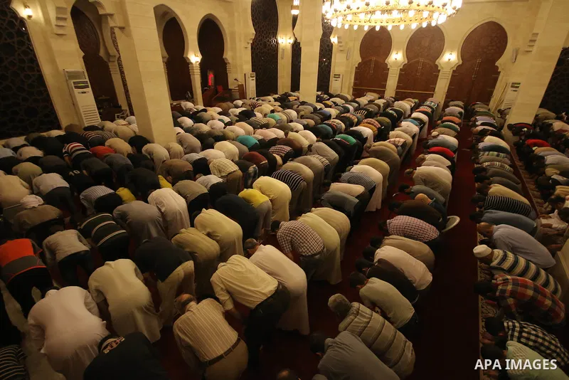 Palestinian worshipers perform take part in an evening prayer "Taraweeh", at El Khalidi mosque, in Gaza city, on June 17, 2015. Millions of Muslims around the world will mark the start of Ramadan on Thursday June 18, a m...