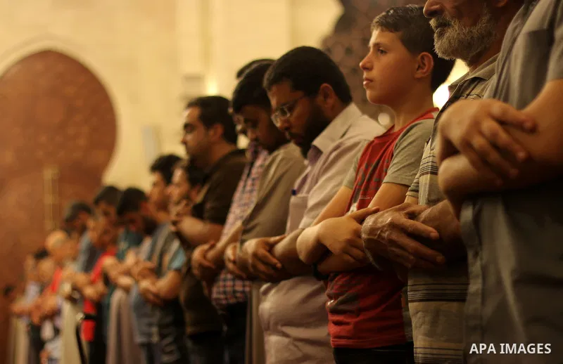 Palestinian worshipers perform take part in an evening prayer "Taraweeh", at El Khalidi mosque, in Gaza city, on June 17, 2015. Millions of Muslims around the world will mark the start of Ramadan on Thursday June 18, a m...