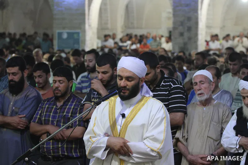 Palestinian worshipers perform 'taraweeh', nightly prayer of the month of Ramadan at Omari mosque, in Gaza city on June 18, 2015. During Ramadan, Muslim believers abstain from eating, drinking, smoking and having sex fro...