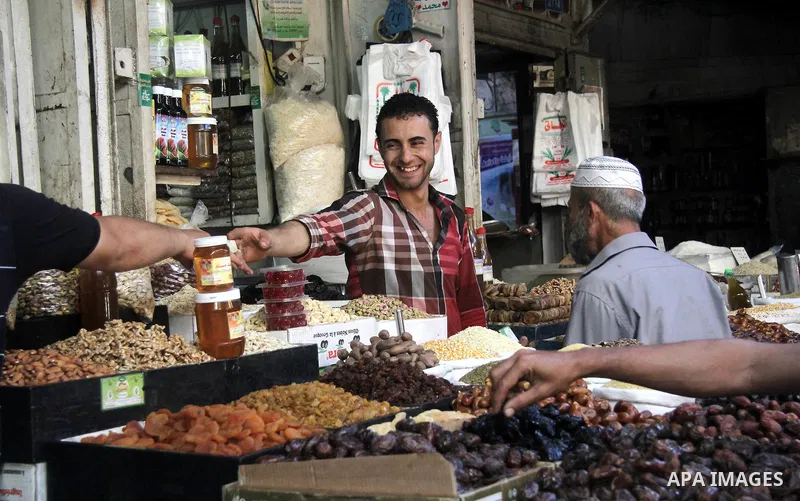 A Palestinian vendor dates at his shop on the first day of the holy month of Ramadan, in Gaza city on June 18, 2015. During Ramadan, Muslim believers abstain from eating, drinking, smoking and having sex from dawn until...