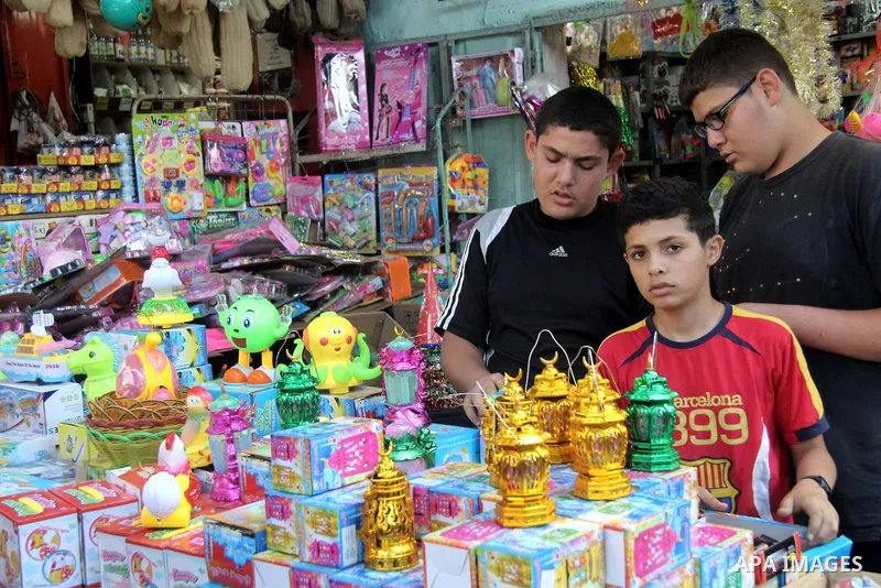 A Palestinian vendor sells lanterns at his shop on the first day of the holy month of Ramadan, in Gaza city on June 18, 2015. During Ramadan, Muslim believers abstain from eating, drinking, smoking and having sex from da...