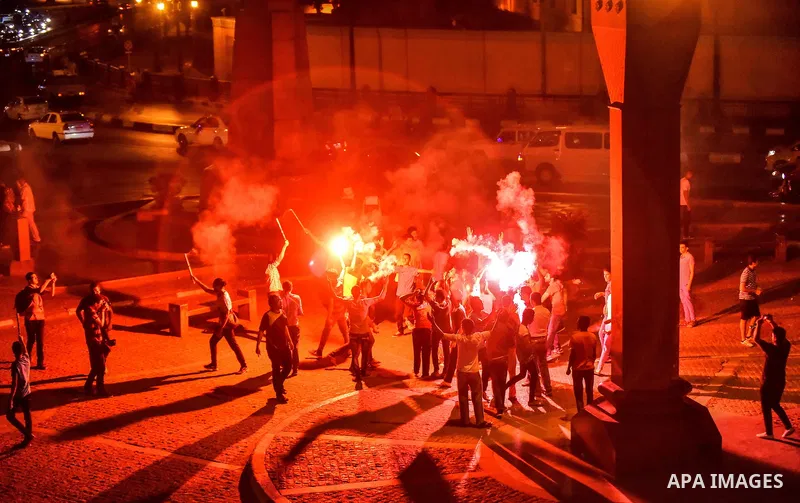 Members of Ultras Nahdawy group, who are supporters of the Muslim Brotherhood and ousted President Mohamed Morsi, light flares and shout slogans during a demonstration against military rule at Abdel Moneim Riad Square in...