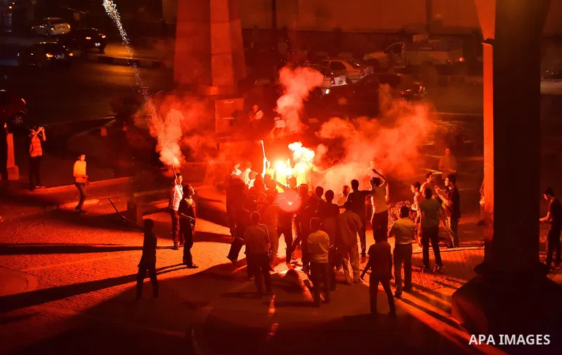 Members of Ultras Nahdawy group, who are supporters of the Muslim Brotherhood and ousted President Mohamed Morsi, light flares and shout slogans during a demonstration against military rule at Abdel Moneim Riad Square in...