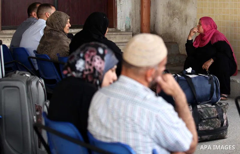Palestinians wait for travel permits to cross into Egypt at the Rafah border crossing between Egypt and southern Gaza Strip June 23, 2015. Egyptian authorities last week decided to open the Rafah crossing to allow Palest...