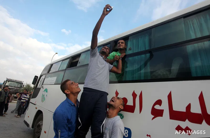 Palestinians wait for travel permits to cross into Egypt at the Rafah border crossing between Egypt and southern Gaza Strip June 23, 2015. Egyptian authorities last week decided to open the Rafah crossing to allow Palest...