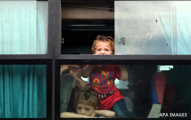 Palestinians wait for travel permits to cross into Egypt at the Rafah border crossing between Egypt and southern Gaza Strip June 23, 2015. Egyptian authorities last week decided to open the Rafah crossing to allow Palest...