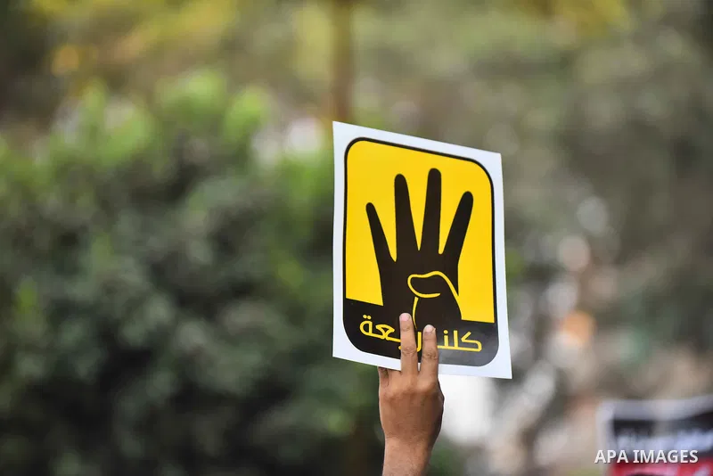 Members of Ultras Nahdawy group, who are supporters of the Muslim Brotherhood and ousted President Mohamed Morsi, light flares and shout slogans during a demonstration against military rule in Cairo, on June 23, 2015. Ph...