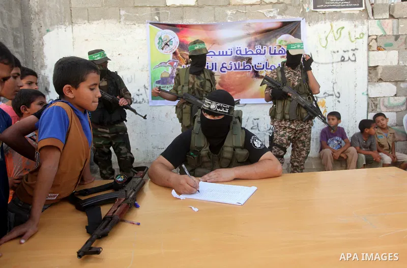 Palestinians boys wail to register their names in the summer camps organized by the Izzedine al-Qassam brigades, loyal to Hamas movement, in Dair Al Balah in the center of Gaza strip on June 25, 2015. Photo by Ashraf Amr...