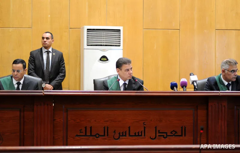 Egyptian Judges attend the trail of former Egyptian president Mohammed Morsi in a court in Cairo on June 27, 2015. Photo by Amr Sayed