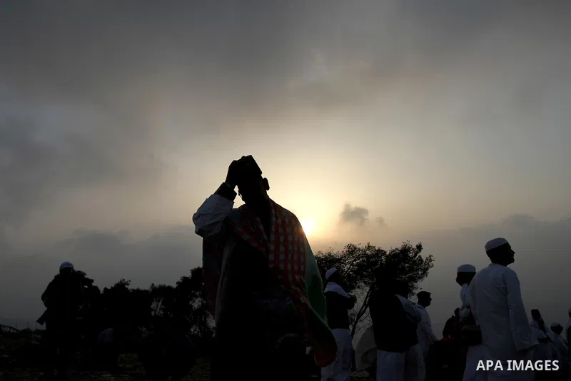 Members of the Samaritan sect pray atop Mount Gerizim near the West Bank city of Nablus, after sunrise on 28 June 2015, as they celebrate the Shavuot festival, marking the giving of the Torah at Mount Sinai seven weeks a...