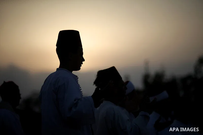 Members of the Samaritan sect pray atop Mount Gerizim near the West Bank city of Nablus, after sunrise on 28 June 2015, as they celebrate the Shavuot festival, marking the giving of the Torah at Mount Sinai seven weeks a...