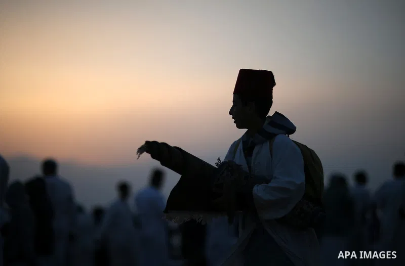 Members of the Samaritan sect pray atop Mount Gerizim near the West Bank city of Nablus, after sunrise on 28 June 2015, as they celebrate the Shavuot festival, marking the giving of the Torah at Mount Sinai seven weeks a...
