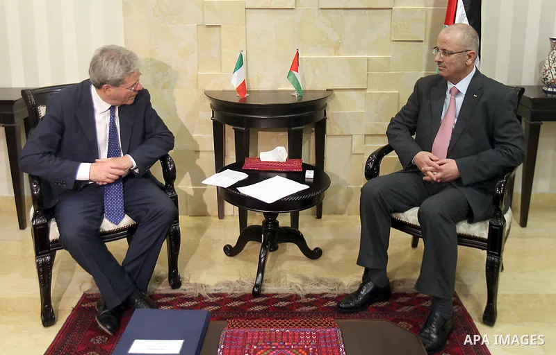 Palestinian Prime Minister Rami Hamdallah meets with Italian Foreign Minister Paulo Jantelaun, in the West Bank city of Ramallah on June 29, 2015. Photo by Prime Minister Office