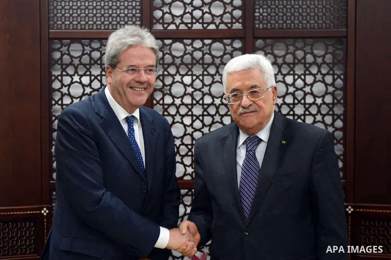 Palestinian President Mahmoud Abbas (R) meets Italian Foreign Minister Paolo Gentiloni in the West Bank city of Ramallah June 29, 2015. Thaer Ganaim