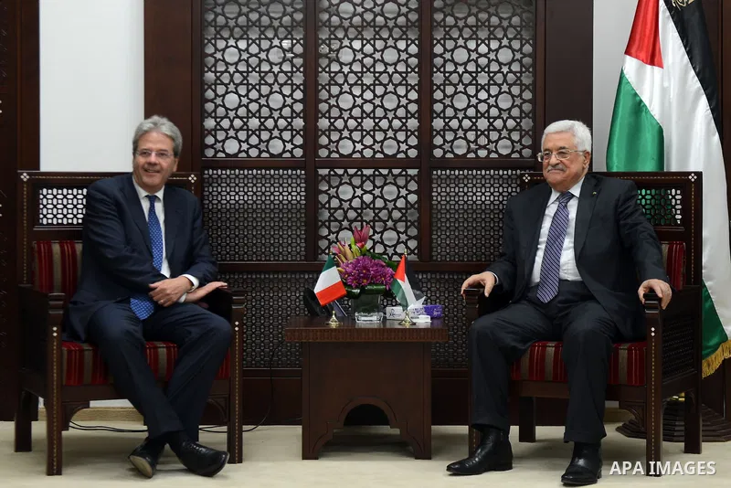 Palestinian President Mahmoud Abbas (R) meets Italian Foreign Minister Paolo Gentiloni in the West Bank city of Ramallah June 29, 2015. Thaer Ganaim
