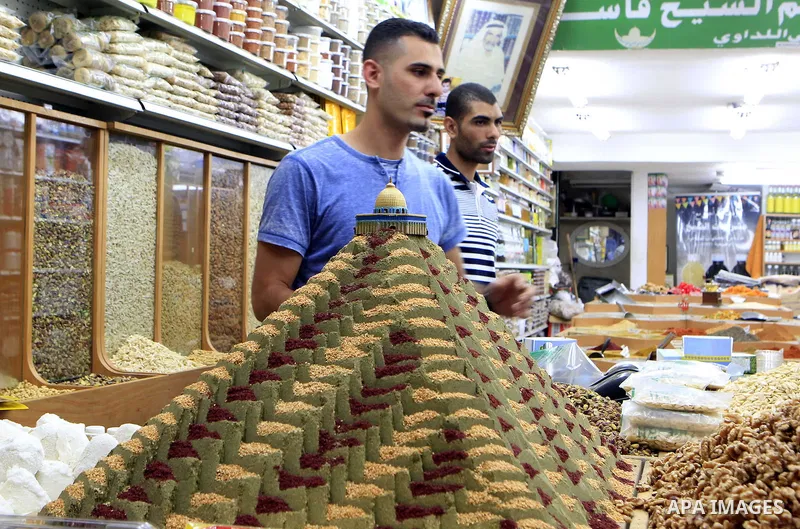 A Palestinian man sells nuts at his shop on the holy month of Ramadan, in Jerusalem's old city on June 29, 2015. During Ramadan, Muslim believers abstain from eating, drinking, smoking and having sex from dawn until suns...