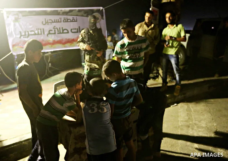 Palestinians boys wait to register their names in the summer camps organized by the Izzedine al-Qassam brigades, loyal to Hamas movement, in Gaza city on June 29, 2015. Photo by Nidal Alwaheidi