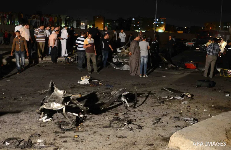 Egypt's security forces investigate the site of an explosion in Six of October district in Cairo, Egypt, Tuesday, June 30, 2015. The blast near a police station occurred hours after President Abdel-Fattah el-Sissi was sp...