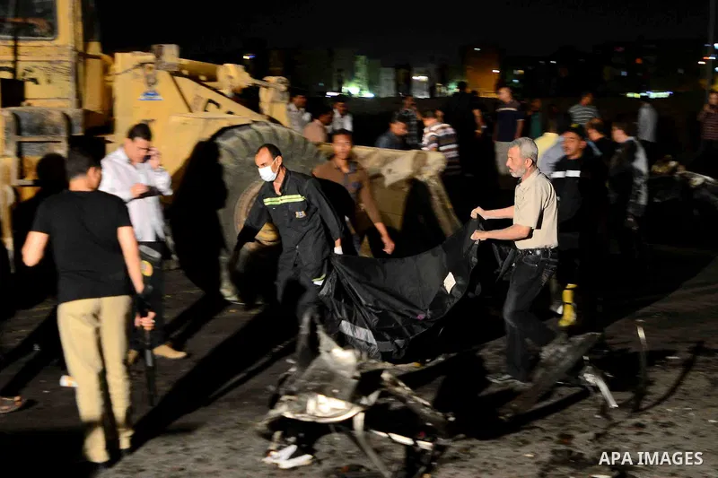 Egypt's security forces investigate the site of an explosion in Six of October district in Cairo, Egypt, Tuesday, June 30, 2015. The blast near a police station occurred hours after President Abdel-Fattah el-Sissi was sp...