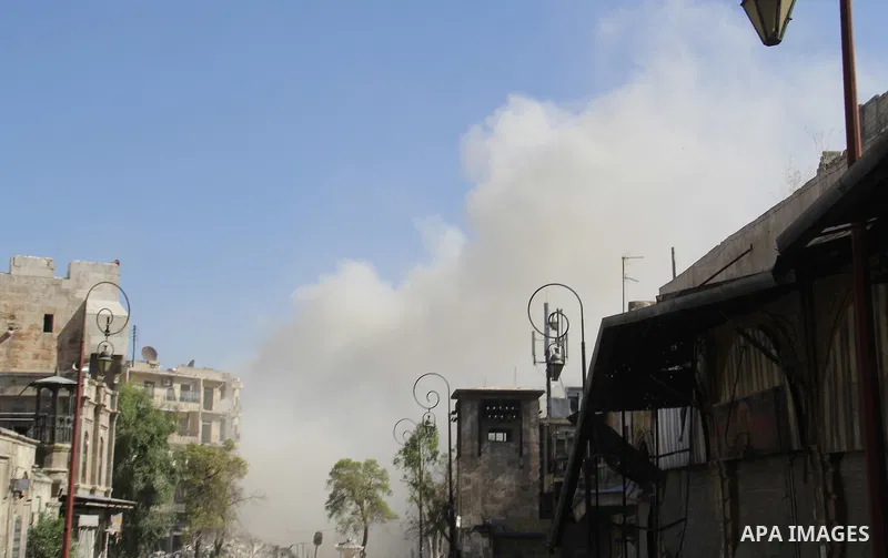Smoke rises after a reported bomb barrel attack by Syrian government forces in Aghyar district in the northern Syrian city of Aleppo July 1, 2015. Photo by Ameer al-Halbi