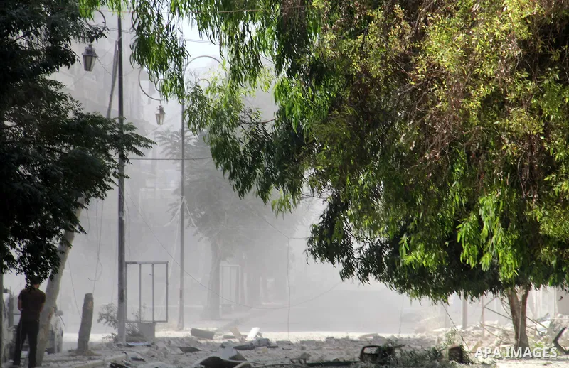 Smoke rises after a reported bomb barrel attack by Syrian government forces in Aghyar district in the northern Syrian city of Aleppo July 1, 2015. Photo by Ameer al-Halbi
