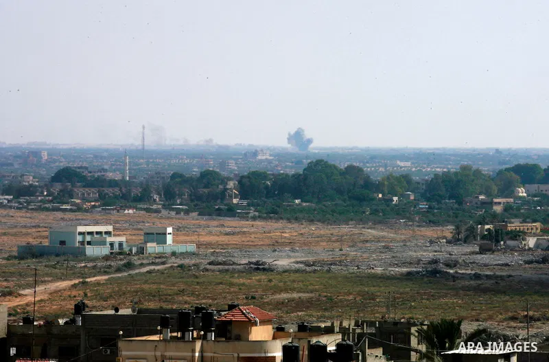 A picture taken from the Rafah border of the southern Gaza Strip with Egypt shows smoke billowing in Egypt's North Sinai on July 2, 2015. At least 70 people, mostly Egyptian soldiers but also civilians, were killed in at...