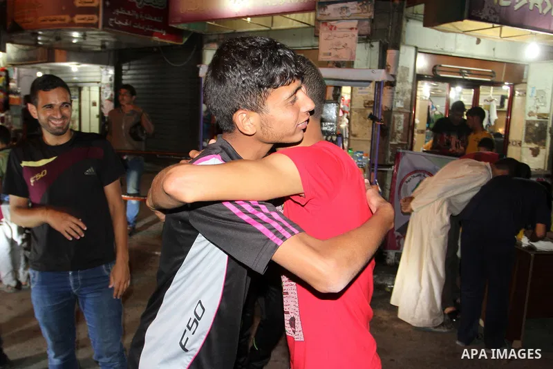 Palestinian high school students celebrate after hearing the results of their final exams known as 'Tawjihi', in Rafah in the southern Gaza Strip on July 3, 2015. Photo by Abed Rahim Khatib