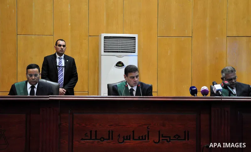Egyptian Judges attend the trail of former Egyptian president Mohammed Morsi in a court in Cairo on July 04, 2015. Photo by Amr Sayed