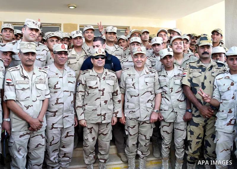 A handout picture released by the Egyptian Presidency on July 4, 2015, shows Egyptian President Abdel Fattah al-Sisi attending a meeting with members of the security forces during a visit to the Sinai Peninsula following...