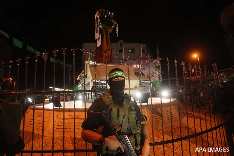 A member of Palestinian Hamas militants holds his weapon during a march marking the first anniversary of the 50-day Israeli war on Gaza Strip last summer, in Gaza City July 8, 2015. July 8th marks the one-year anniversar...