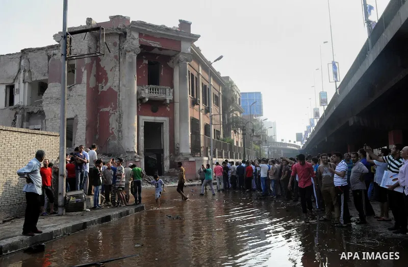 Egyptian security officials inspect the site of a bomb blast at the Italian Consulate in Cairo, Egypt, July 11, 2015. A bomb exploded in front of the Italian consulate in Cairo on Saturday, killing one person, the health...