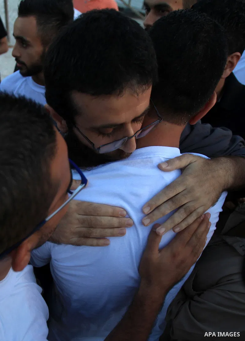 Khader Adnan, a Palestinian prisoner who staged a 56-day hunger strike while being detained for a year without charge by Israeli authorities, is greeted by friends and relatives as he arrives in the West Bank village of...