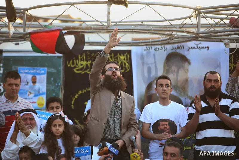 Palestinian Islamic Jihad leader Khader Adnan gestures as he speaks during a rally honoring him following his release, near the West Bank city of Jenin July 12, 2015. Israel on Sunday released Adnan from jail following a...