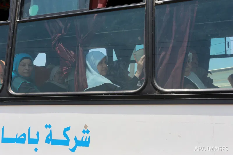 Palestinian Worshipers wait leave Gaza to enter Jerusalem to attend Laylat Al Qadr, also known as the Night of Power at Al Aqsa Mosque, through the Erez border crossing between Israel and northern Gaza Strip on July 13,...