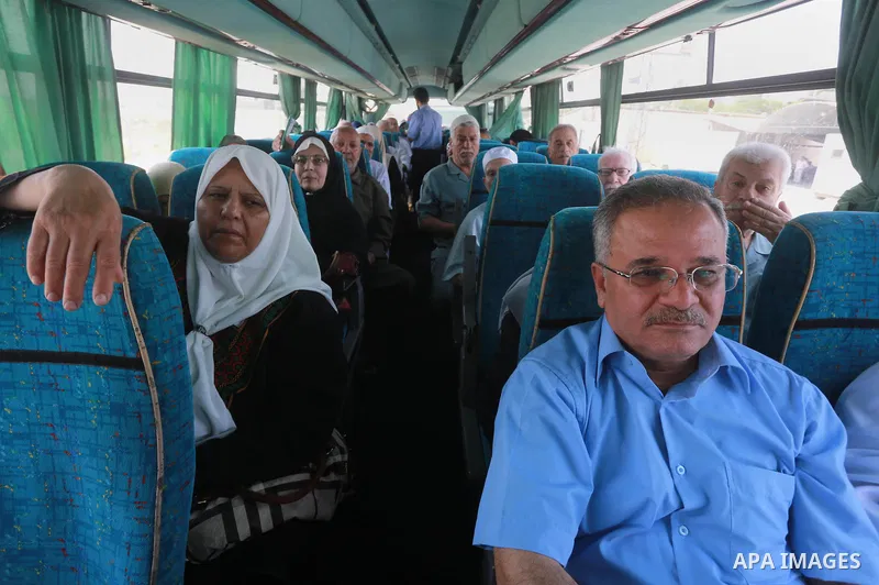 Palestinian Worshipers wait leave Gaza to enter Jerusalem to attend Laylat Al Qadr, also known as the Night of Power at Al Aqsa Mosque, through the Erez border crossing between Israel and northern Gaza Strip on July 13,...